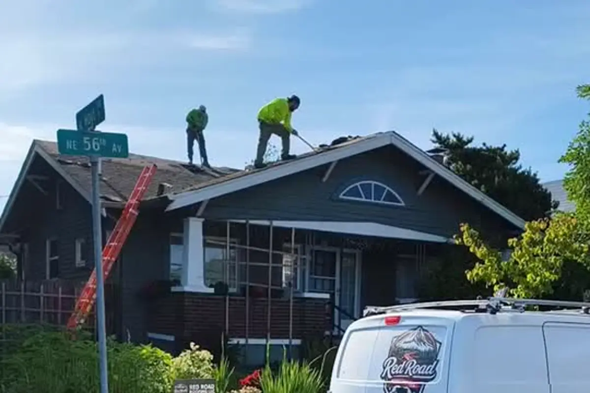 Red Road Roofing team working on a Portland-area home